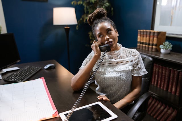 a%20property%20manager%20taking%20a%20call%20at%20their%20desk